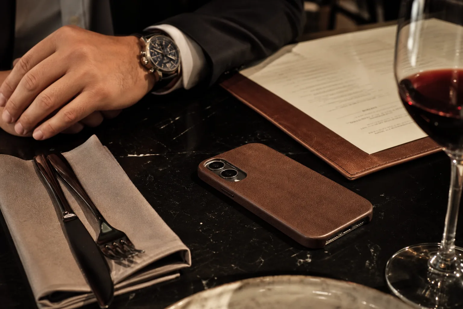 Lifestyle scene illustrating leather-style phone cases for work and dinner