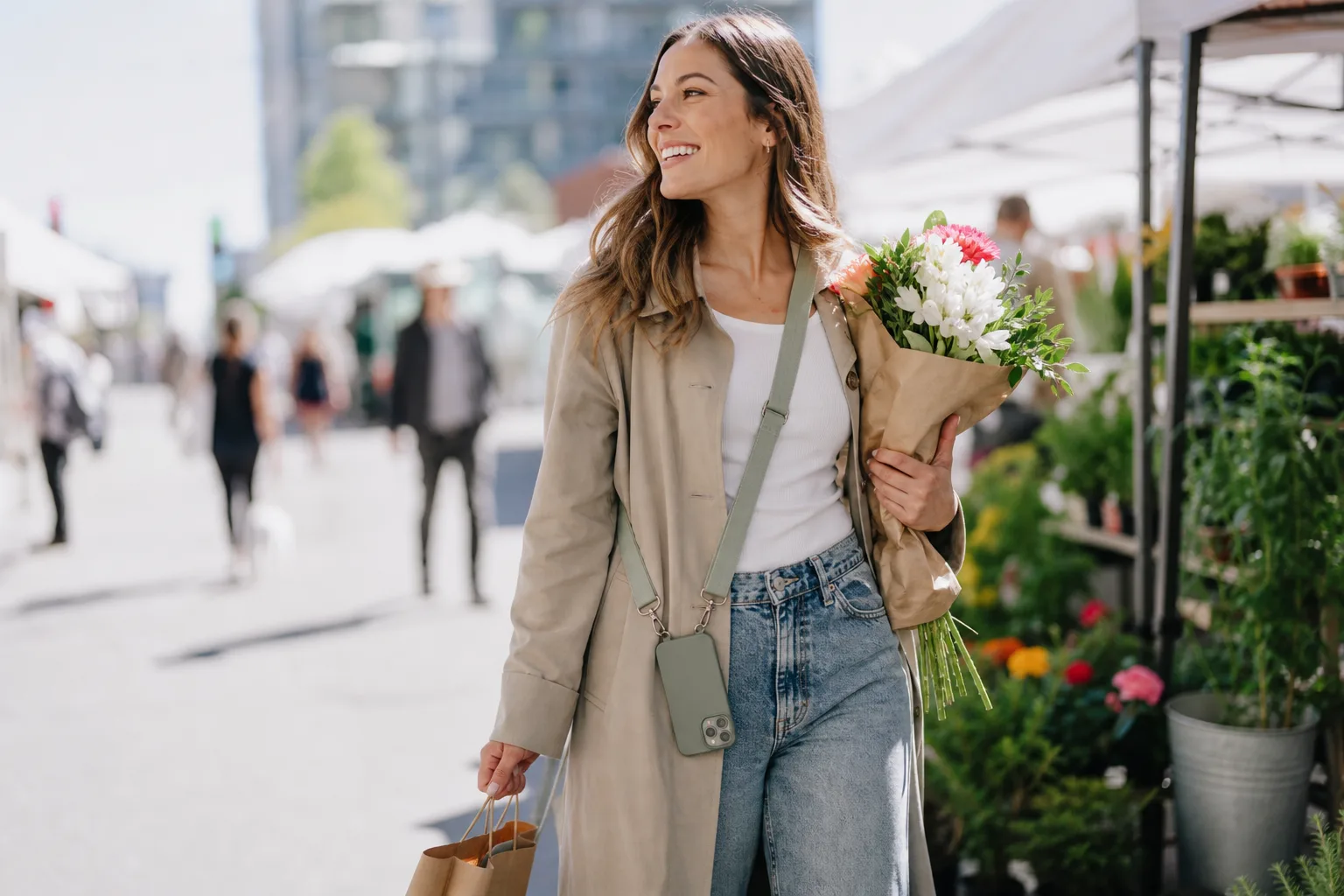 Lifestyle scene illustrating phone straps and crossbody cases for city weekends